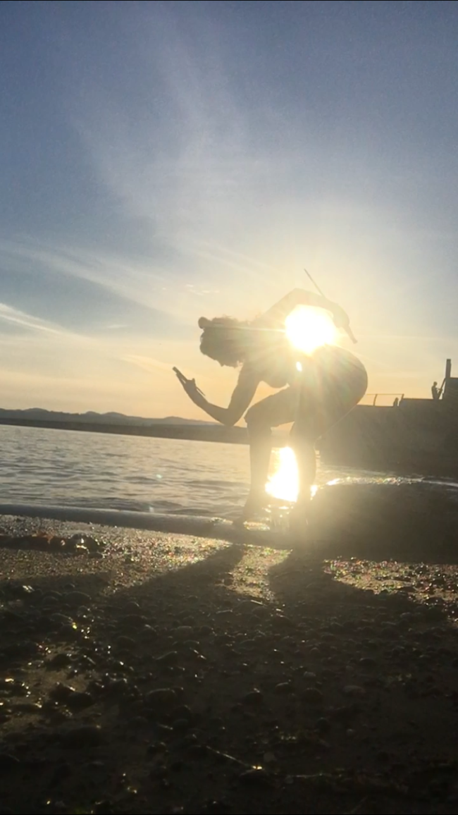 Mary training on beach with sai